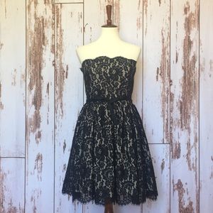 Lace overlay black dress by Robert Rodriguez